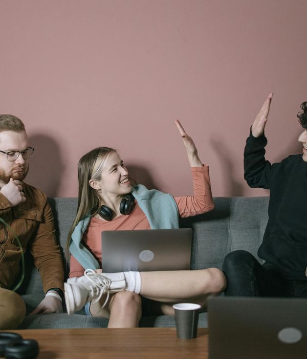 A woman feeling energetic and happy in a bright room.
